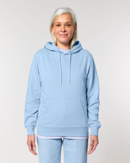 Person wearing a light blue hoodie and pants on a plain background